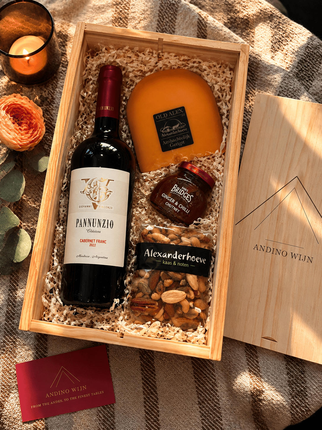 An Andino Wijn corporate gift box holding a bottle of Pannunzio Cabernet Franc, a wedge of aged Gouda, a jar of ginger and chilli chutney, and mixed nuts