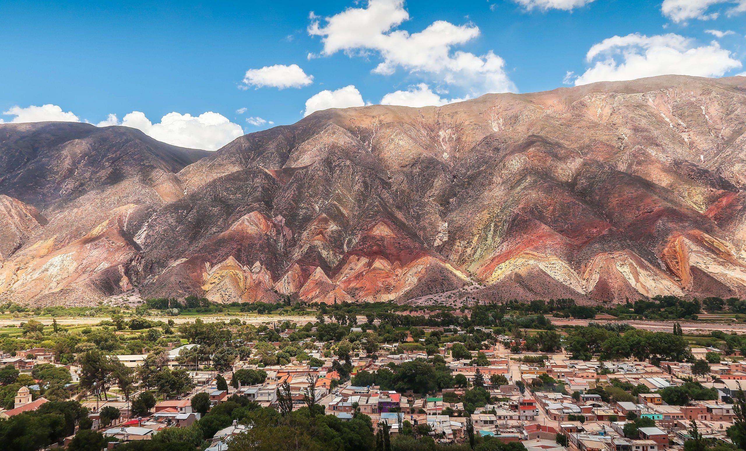 The dry, multicoloured mountains of the Calchaquí valleys above a small town in Salta